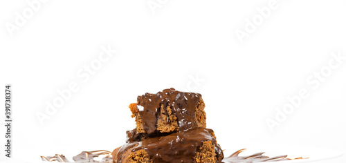 Chocolate dessert poured with chocolate isolated on a white background