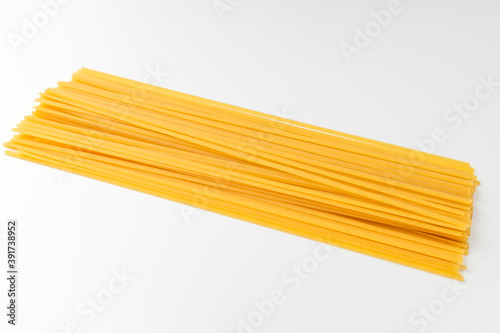 Linguini pasta on white background