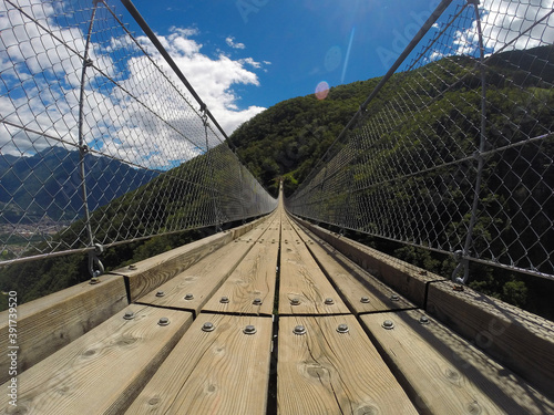 The suspended bridge of the Carasso mount in Switzerland photo