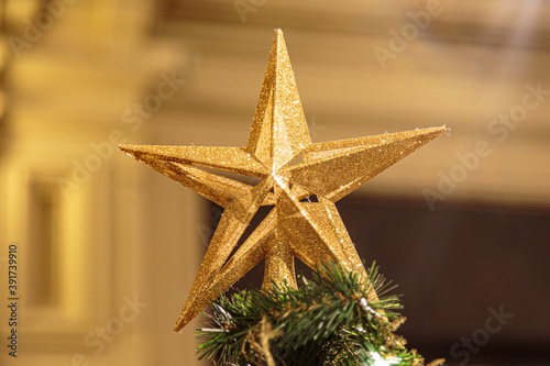 Christmas background with decorative star, fir branches and pine cones