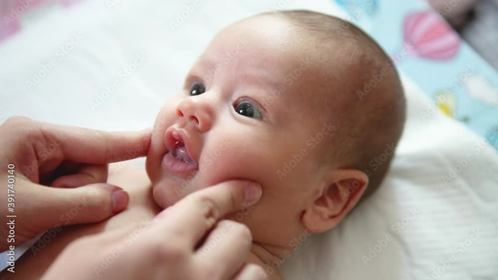 Caring mother and newborn baby are playing in the morning. Caring mother and newborn baby are playing in the morning.
