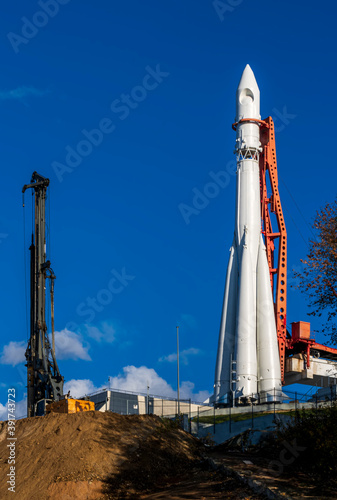 construction machinery and architectural engineering on a construction site, cran and drilling rig on a building rocket launch facility
