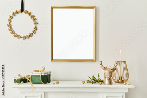 Christmas composition with gold mock up poster frame  white chimney and decoration. Christmas trees and wreath  candles  stars  light and elegant accessories. Template.