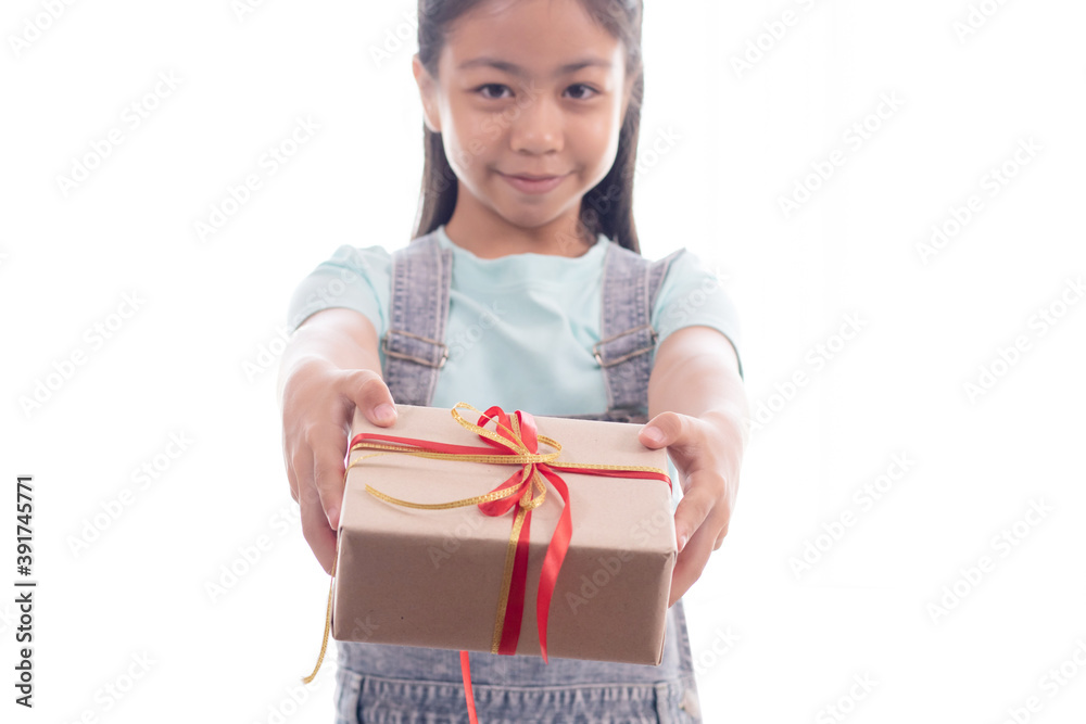 Adorable Asian smart girl in casual jean give the gift box with red ribbon to camera, happy smiling girl with gift box give present to you on white background Adorable Asian smart girl in casual jean give the gift box with red ribbon to camera, happy smiling girl with gift box give present to you on white background