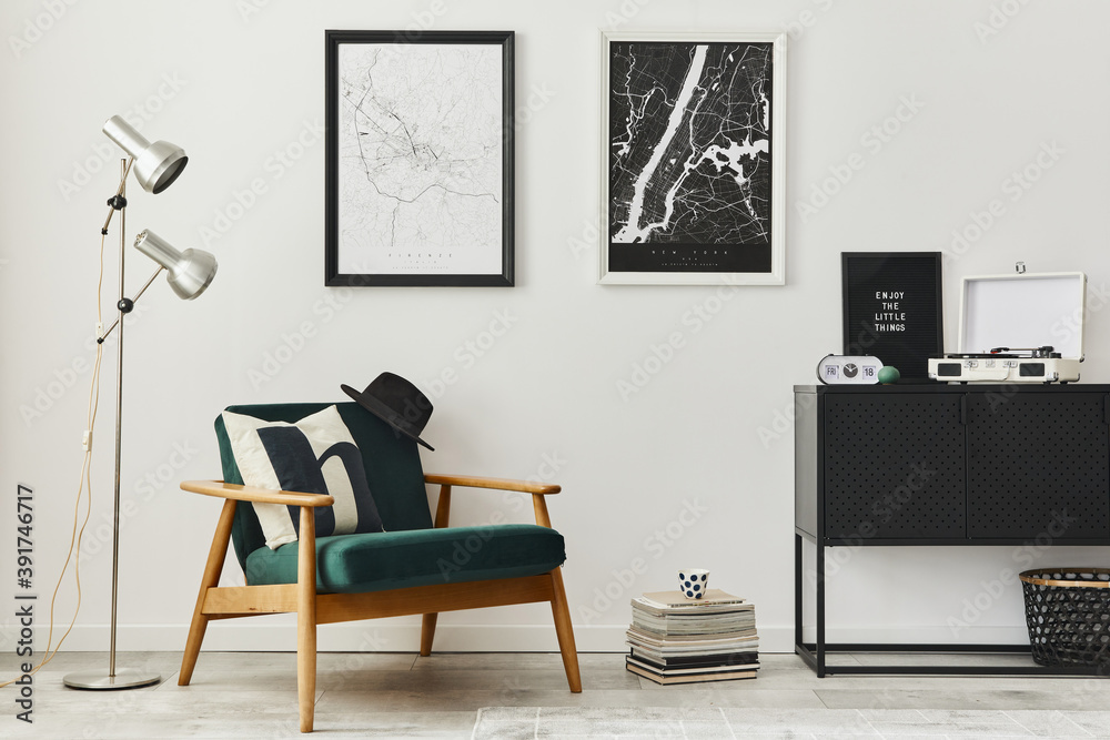 Retro and minimalist compositon of living room interior with design armchair, two mock up poster map, lamp, decoration, white wall and personal accessories. Template. Modern home decor. Retro and minimalist compositon of living room interior with design armchair, two mock up poster map, lamp, decoration, white wall and personal accessories. Template. Modern home decor.