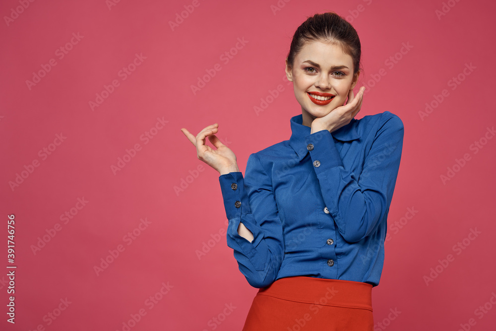 fashionable woman in blue shirt on pink background Red skirt emotions model gesturing with hands cropped view Copy Space fashionable woman in blue shirt on pink background Red skirt emotions model gesturing with hands cropped view Copy Space