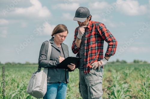 Mortgage loan officer assisting farmer in financial allowance application process