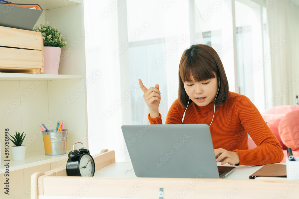 Beautiful young asian thai black short hair woman giving opinion while study from home with laptop computer. Beautiful young asian thai black short hair woman giving opinion while study from home with laptop computer.