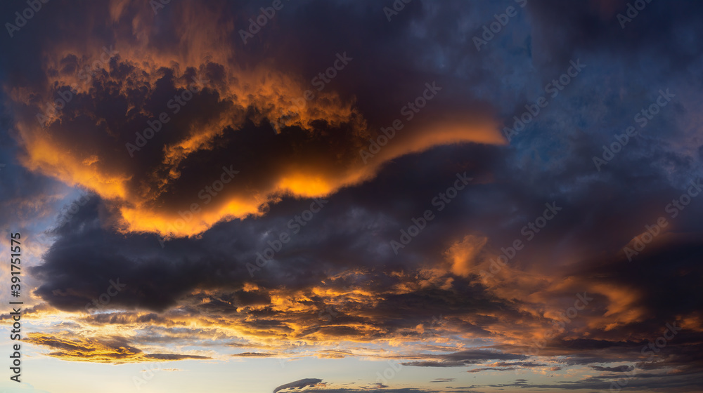 beautiful dark cloudscape at sunset with red clouds