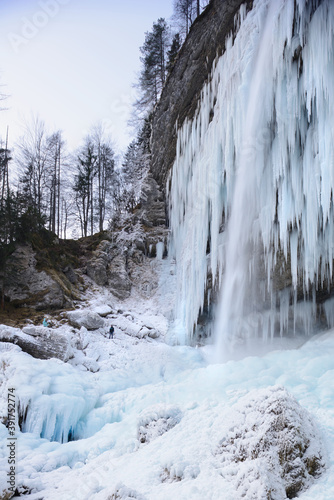 Icicle on frozen waterfall in winter in the Alps