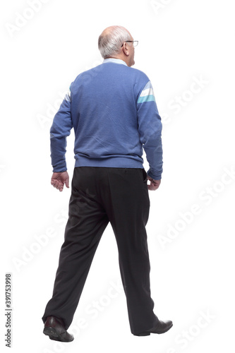rear view. an elderly man confidently striding away © ASDF