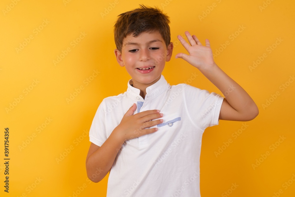 I swear, promise you not regret. Portrait of sincere Young handsome Caucasian little boy raising one arm and hold hand on heart as give oath, telling truth, want you to believe. I swear, promise you not regret. Portrait of sincere Young handsome Caucasian little boy raising one arm and hold hand on heart as give oath, telling truth, want you to believe.