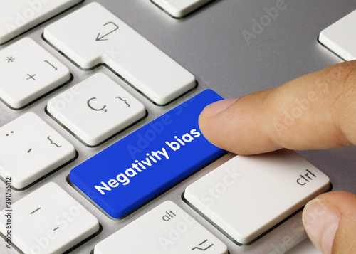 Negativity bias - Inscription on Blue Keyboard Key. photo