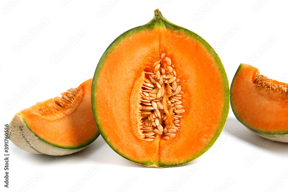 Half of the cantaloupe melon and a piece of melon are isolated on a white background. Half of the cantaloupe melon and a piece of melon are isolated on a white background.
