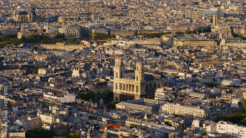 Aerial panorama view of historic city center of Paris, France with popular cathedral Saint-Sulpice (Roman Catholic church) and Centre Pompidou in background in the beautiful evening sun in autumn.