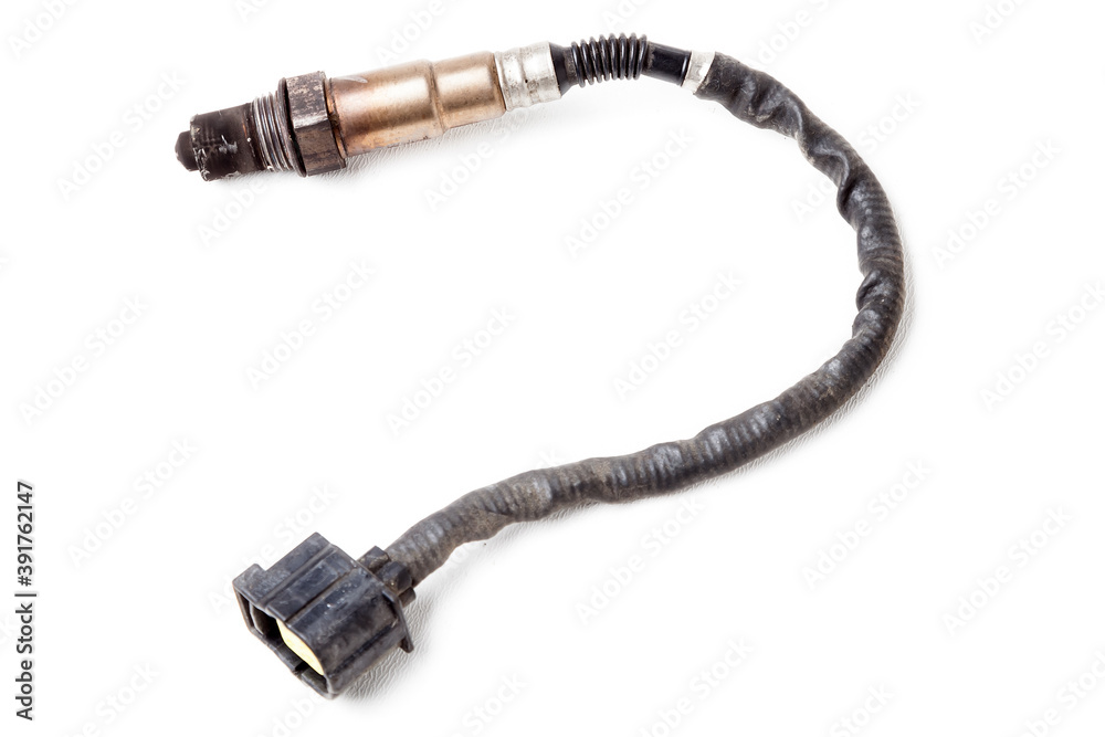 Lambda probe - oxygen sensor device designed to record tamount of remaining oxygen in the exhaust gas of car engine is located in exhaust system. Metal spare part for replacement to repair in workshop Lambda probe - oxygen sensor device designed to record tamount of remaining oxygen in the exhaust gas of car engine is located in exhaust system. Metal spare part for replacement to repair in workshop