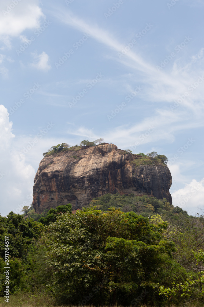 Sigiriya Rock Sri Lanka photographed from rear above forest with blue sky