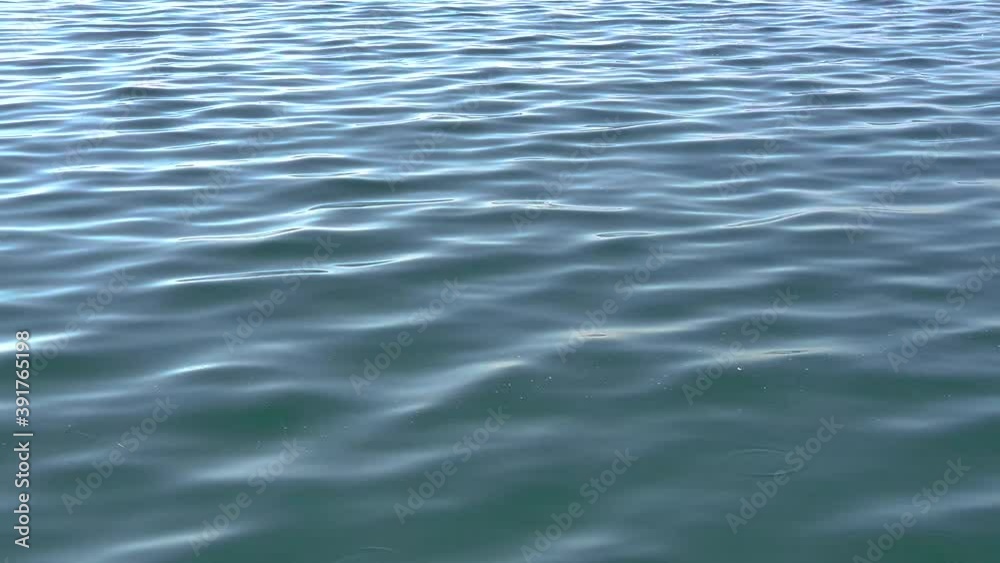 Calm blue sea on urban shore Calm blue sea on urban shore