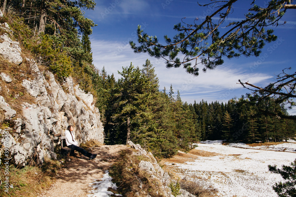 woman relax in winter forest with lake view and mountains in snow. sexy woman walk in snowy forest with lake view. Pine forest covered with snow and mountains background in Durmitor, The Black Lake woman relax in winter forest with lake view and mountains in snow. sexy woman walk in snowy forest with lake view. Pine forest covered with snow and mountains background in Durmitor, The Black Lake