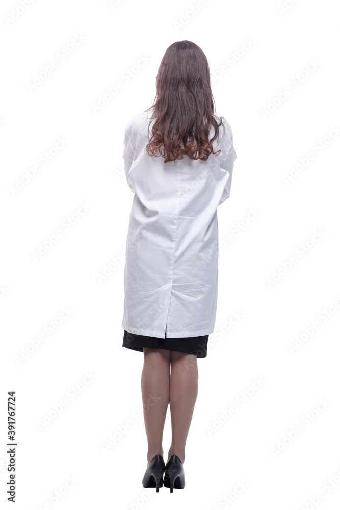 rear view. female doctor looking at a white blank screen rear view. female doctor looking at a white blank screen