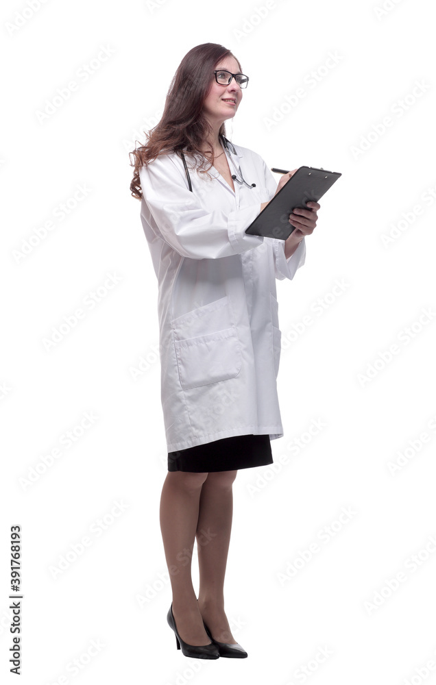 in full growth. young doctor making notes in the clipboard in full growth. young doctor making notes in the clipboard