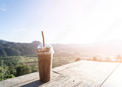 ice mocha coffee and mountain view in sunlight morning
