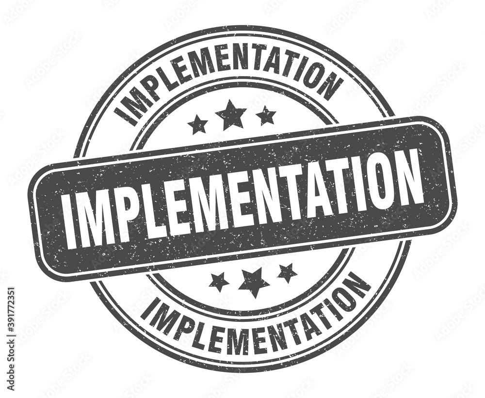 Obraz premium implementation stamp. implementation label. round grunge sign