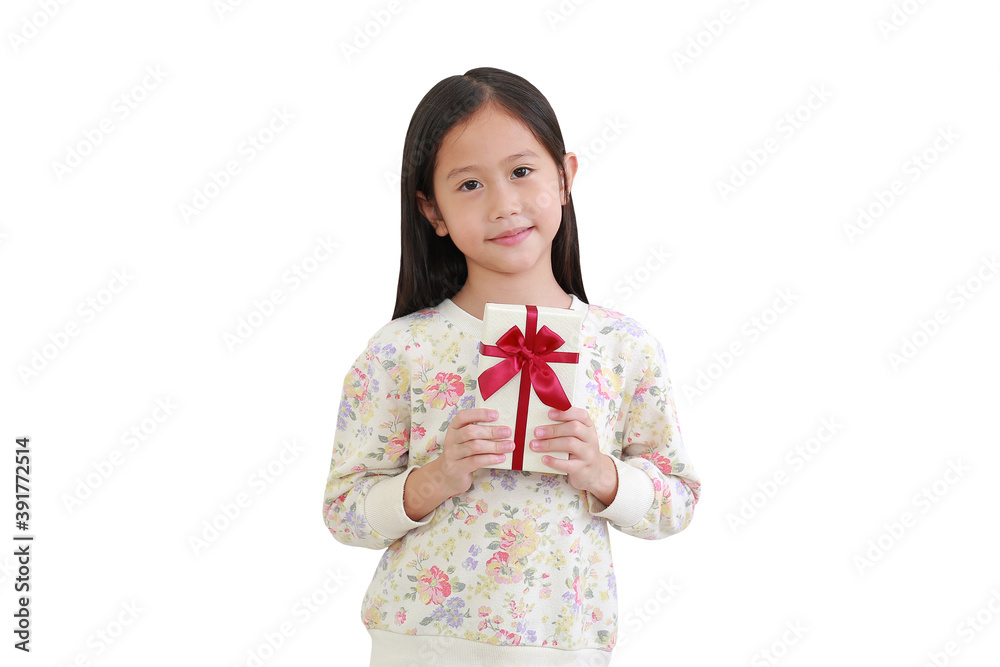 Cute little asian kid girl holding gift box on white background. with clipping path Cute little asian kid girl holding gift box on white background. with clipping path