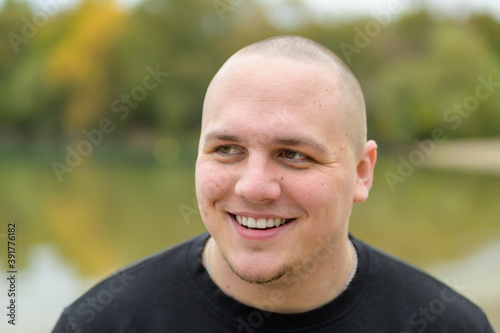 Happy young man laughing at the camera