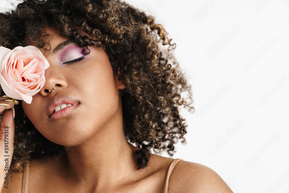 Beautiful sensual african american girl posing with rose - obrazy, fototapety, plakaty 
