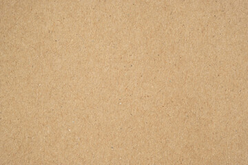 Texture of brown craft or kraft paper background, cardboard sheet, recycle paper, copy space for text.