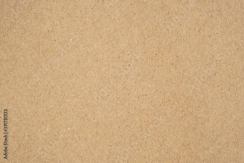 Texture of brown craft or kraft paper background, cardboard sheet, recycle paper, copy space for text. photo