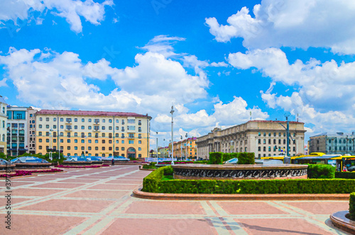 Watercolor drawing of Minsk: Independence square and Avenue with Socialist Classicism Stalin Empire style buildings and Hotel Minsk in city centre, blue sky white clouds in sunny summer day