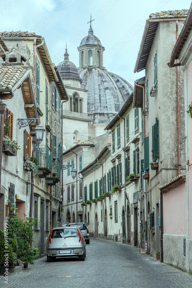 bending street and massive s. Margherita church dome, Montefiascone, Viterbo, Italy