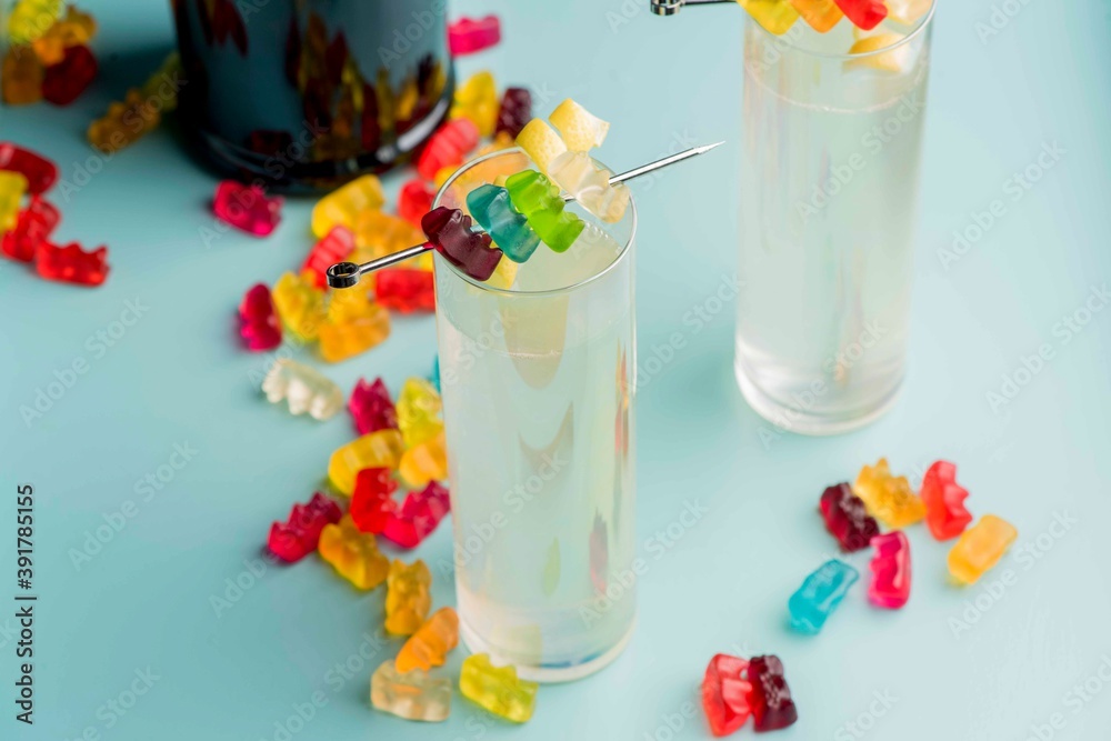 Cocktails. Traditional American drinks made by artisanal bartenders or mixologists in speakeasy & upscale bars or dives or taverns.Cocktails served in chilled cocktail glasses & garnished with fruit.