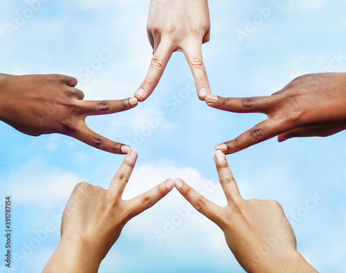 Black and white people forming five pointed star with their fingers.