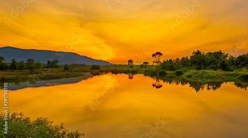 sunset in the mountains over the lake