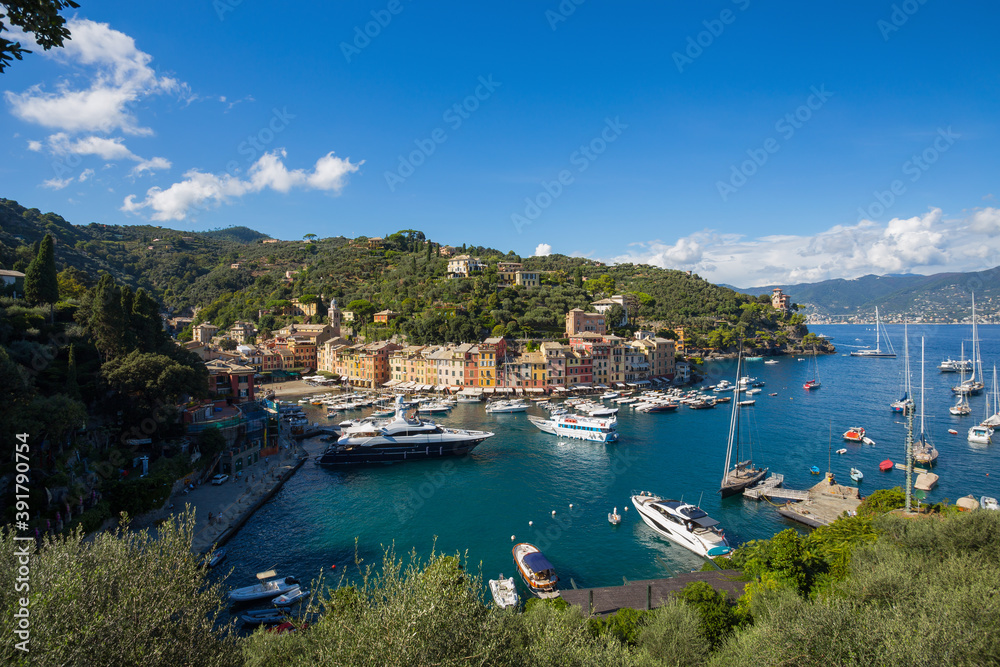 PORTOFINO, ITALY, SEPTEMBER 1, 2020 - Aerial view of Portofino, an Italian fishing village, Genoa province, Italy. A famous tourist place with a picturesque harbour and colorful houses.