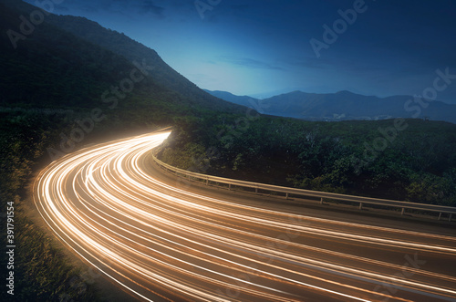 Lightstrails of vehicles in movement for a road in the moonlight