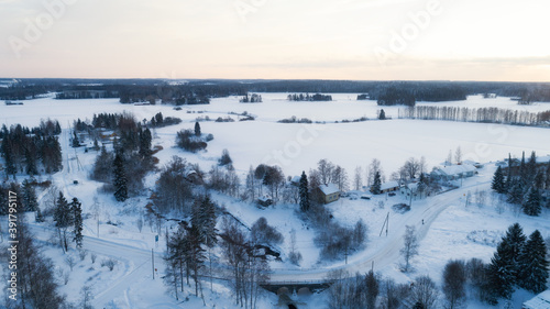 Aerial view of the forest and river at winter. Trees are covered with snow. Winter. snow-covered fields. Finland.