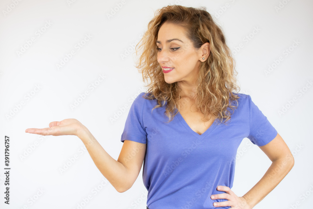Woman surprise showing product .Beautiful woman with curly hair pointing to the side. Presenting your product. Woman surprise showing product .Beautiful woman with curly hair pointing to the side. Presenting your product.