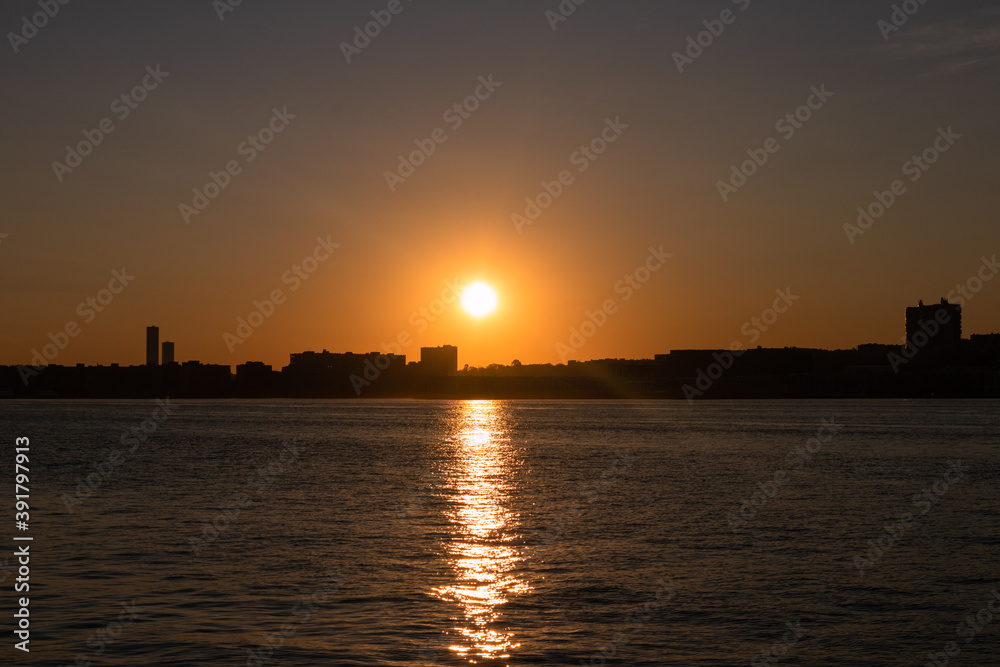 Sunset over a Silhouette of the Weehawken New Jersey Skyline along the Hudson River