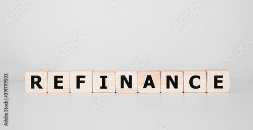 Focus on wooden blocks with text Refinance