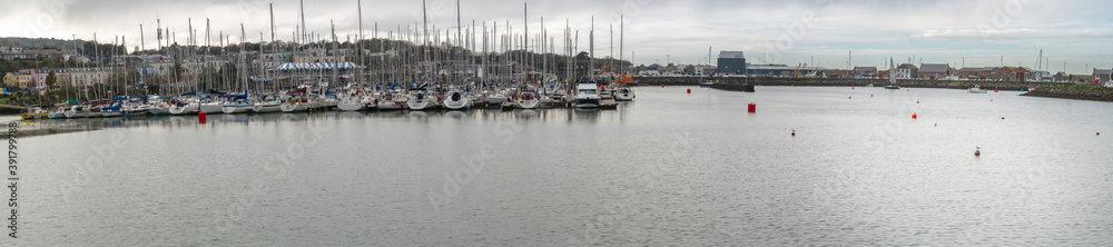 Amazing panoramic view at Howth marina bay, near Dublin, Ireland with yachts and boats. Typical small harbour.