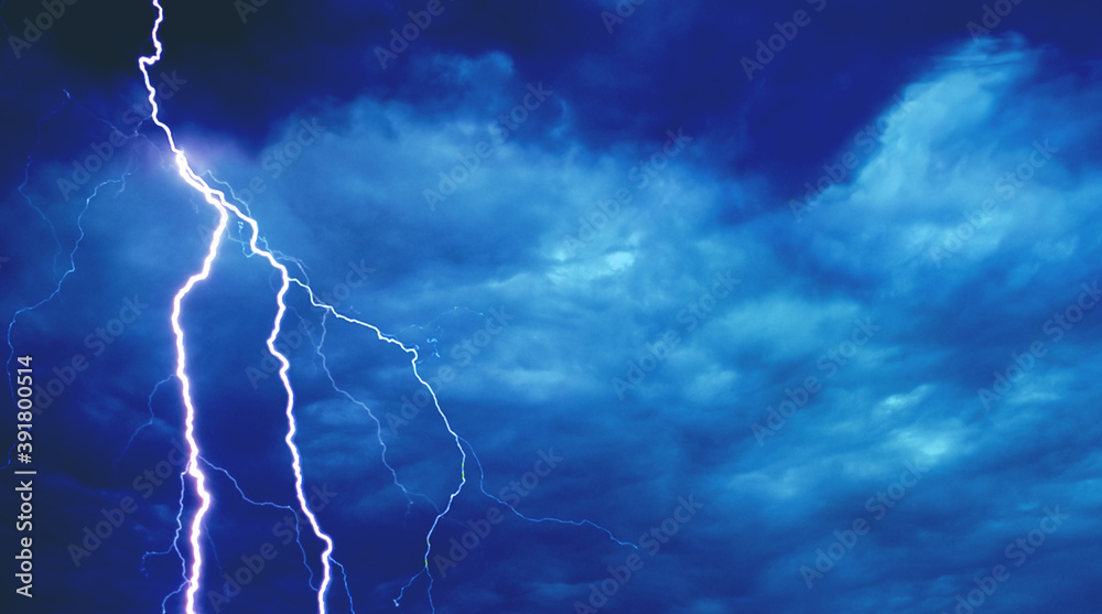 Lightning in the dark blue sky. Stormy sky. Thunderstorm on a dark blue  background. Lightning flashes across the night sky. Natural disaster.  Hurricane, Typhoon, tornado, storm. Stock Photo | Adobe Stock