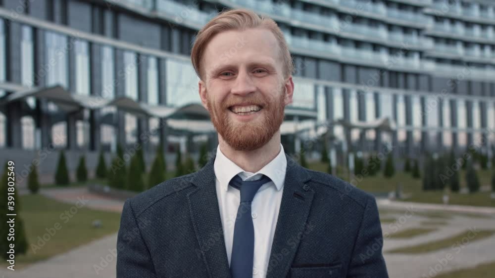 Portrait of Middle age confident successful attractive caucasian business person with beard and mustache, looking at camera laughing. Businessman. Success concept. Formal black suit tie Slow Motion 4K Portrait of Middle age confident successful attractive caucasian business person with beard and mustache, looking at camera laughing. Businessman. Success concept. Formal black suit tie Slow Motion 4K
