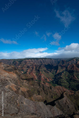 Waimea Canyon State Park, located on the oldest Hawaiian island of Kaua'i, is known as the "Grand Canyon of the Pacific". The canyon is famous for its reddish soil complementing its green foliage. 