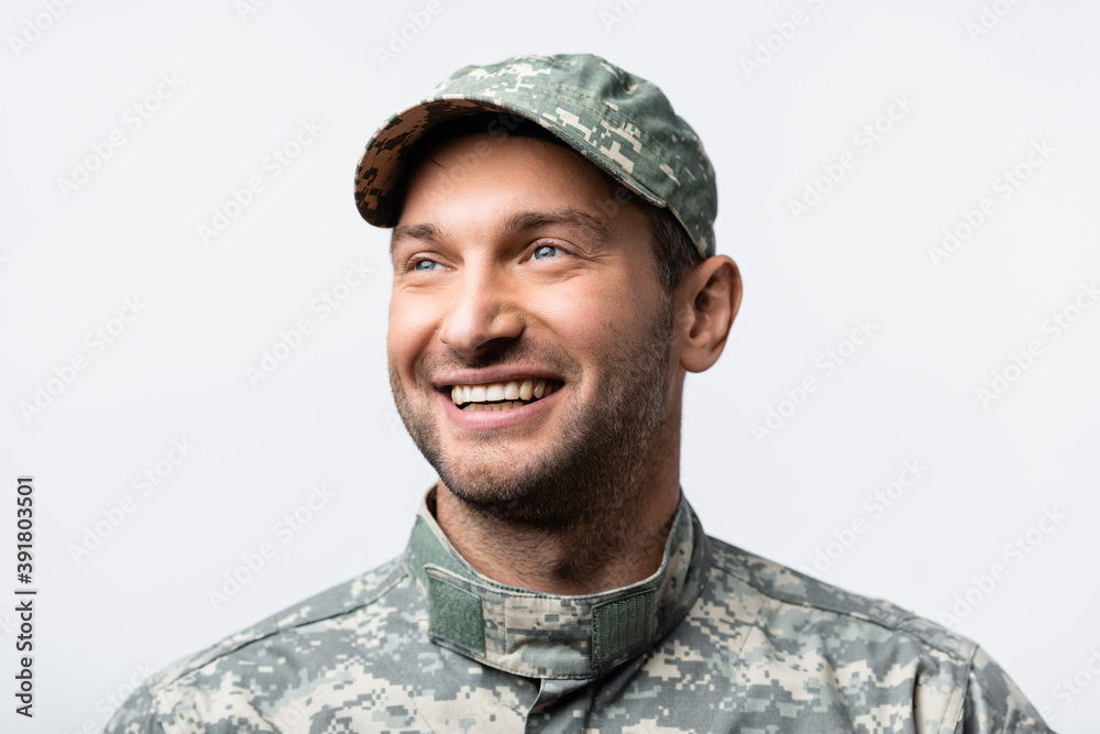 happy military man in uniform and cap looking away isolated on white happy military man in uniform and cap looking away isolated on white