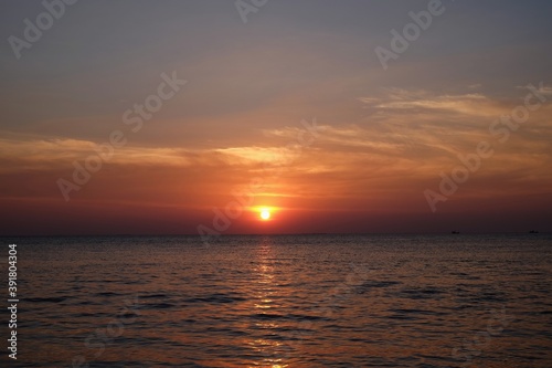 beautiful sunset on the sea with colorful sky © wachira