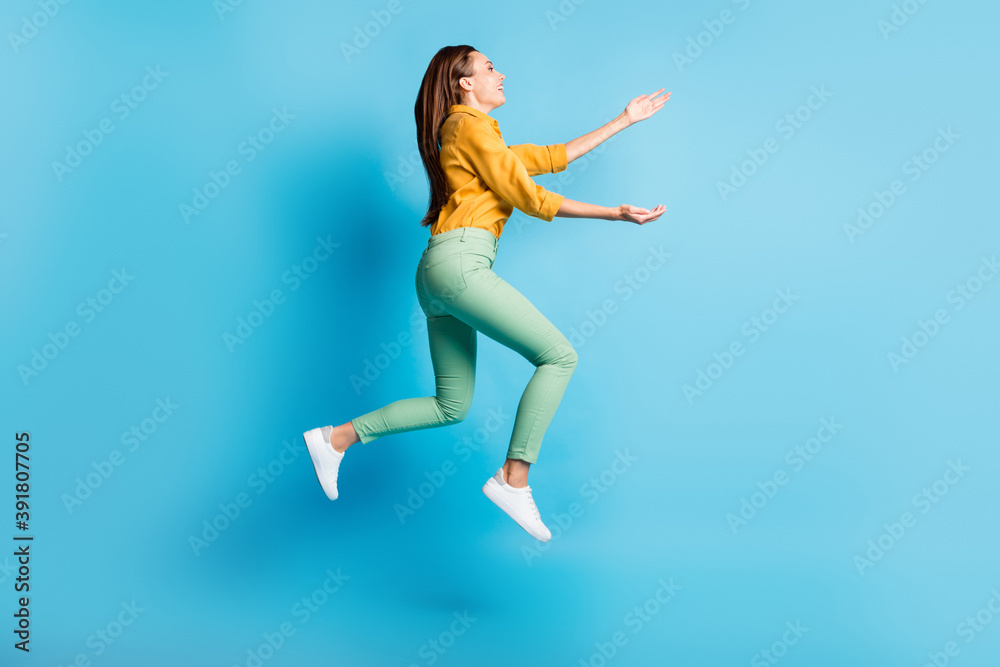Full size profile photo of cool nice brunette lady jump hug wear shirt trousers sneakers isolated on turquoise color background
